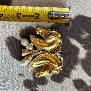 Gold colored two horse pin